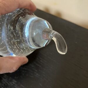 Clear glass pear with controlled bubbles (bullicante) paperweight